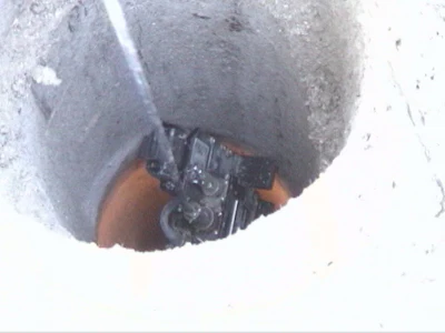 An Inuktun crawling robot being lowered into a hole at the World Trade Center site in 2001.