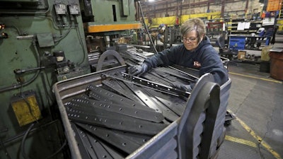 In this Thursday, April 22, 2021 file photo, Marie Tibbott sorts product at EIP Manufacturing in Earlville, Iowa. Growth in U.S. manufacturing picked up in May, even as supply chain problems persist and businesses continue to struggle to find workers. The Institute for Supply Management, a trade group of purchasing managers, said Tuesday, June 1 that its index of manufacturing activity rose in May to a reading of 61.2 from 60.7 in April.