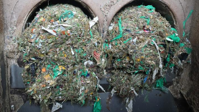 Plastic residue being filtered out of food waste collected in Norway after fermentation to biogas and soil fertilizer.
