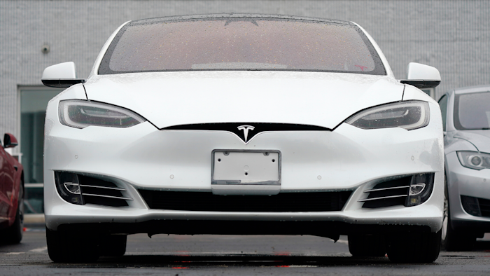 This Sunday, May 9, 2021 file photo shows vehicles at a Tesla location in Littleton, Colo. Tesla delivered 201,250 vehicles in the second quarter, an improvement over first-quarter figures but below the expectations of Wall Street analysts. Tesla and other automakers have been hampered by a global shortage of computer chips.