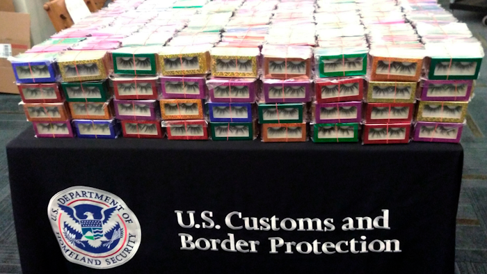 This photo provided by U.S. Customs and Border Protection shows boxes of long lashes seized Tuesday, July 6, 2021 at Louis Armstrong New Orleans International Airport. Three thousand pairs of false eyelashes have been seized by U.S. Customs and Border Protection agents after officials determined they were illegally imported from China to New Orleans. Agency spokesperson Matthew Dyman tells WVUE-TV that the four boxes of long lashes seized Tuesday were destined for a local beauty supply store.