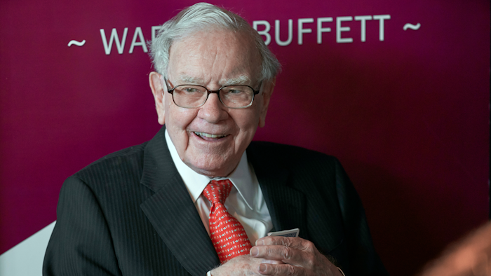 In this May 5, 2019, file photo Warren Buffett, Chairman and CEO of Berkshire Hathaway, smiles as he plays bridge following the annual Berkshire Hathaway shareholders meeting in Omaha, Neb.