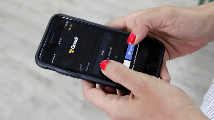 A woman looks at the Grindr app on her mobile phone in Beirut, Lebanon, May 29, 2019.