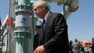 Agriculture Secretary Tom Vilsack tours a tribal wastewater facility on Wednesday, July 7, 2021, in Ohkay Owingeh, New Mexico. Vilsack announced that the Pueblo will receive a $610,000 loan and a $1.6 million grant in state money to expand the wastewater treatment plant where.