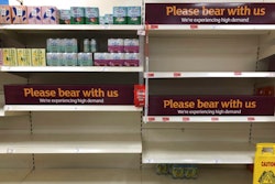 Empty shelves and signs in the soft drinks aisle of a Sainsbury's store in Rowley Regis, England, July 22, 2021.