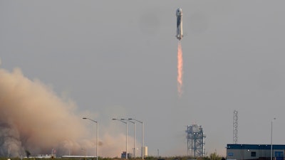 Blue Origin's New Shepard rocket launches carrying passengers Jeff Bezos, founder of Amazon and space tourism company Blue Origin, brother Mark Bezos, Oliver Daemen and Wally Funk, from its spaceport near Van Horn, Texas, Tuesday, July 20, 2021.