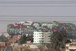 In this grab taken from file video, a view of huge container ship, Ever Given on the Suez Canal. The huge container ship that blocked the Suez Canal for nearly a week earlier this year has finally reached the port of Rotterdam to begin unloading its cargo.