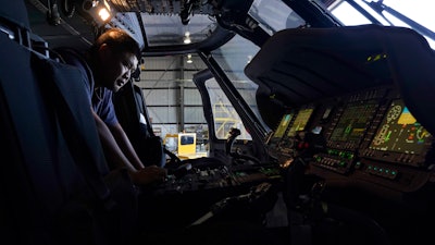 Avionics mechanic Mike Luong inspects the control panel of Sikorsky Firehawk helicopter at the California Department of Forestry and Fire Protection's Sacramento Aviation Management Unit based at McClellan Airpark in Sacramento, Calif., Friday, July 23, 2021.