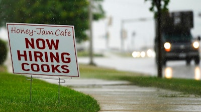 A hiring sign is shown in Downers Grove, Ill., Thursday, June 24, 2021. The number of Americans collecting unemployment benefits slid last week, another sign that the job market continues to recover rapidly from the coronavirus recession.Jobless claims dropped by 24,000 to 400,000 last week, the Labor Department reported Thursday, July 29, 2021.