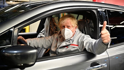 British Prime Minister Boris Johnson visits the Nissan Motor Co. plant, in Sunderland, England, Thursday, July 1, 2021. Japanese carmaker Nissan and two partners announced plans to invest 1 billion ($1.4 billion) pounds to produce a new model of an all-electric vehicle and batteries in northeast England.