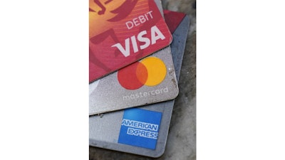 American Express, Visa and Master card cards on display in Richmond, Va., Thursday, July 1, 2021. U.S. consumer borrowing surged by $35.3 billion in May as Americans, bolstered by a reopening economy and rising job levels, went back to using credit in a big way.