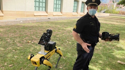 Honolulu Police Acting Lt. Joseph O’Neal demonstrates a robotic dog in Honolulu, May 14, 2021.