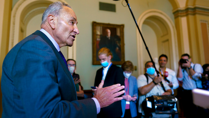 Senate Majority Leader Chuck Schumer, D-N.Y., updates reporters on the infrastructure negotiations between Republicans and Democrats, at the Capitol in Washington on July 28.