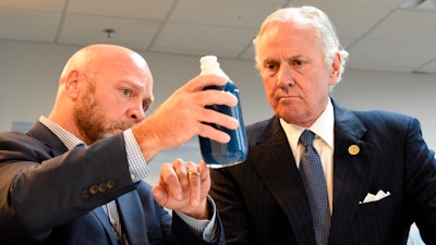 South Carolina Gov. Henry McMaster, right, listens as Foster Jordan of Charles River Labs, left, talks about the properties of horseshoe crab blood, which is a vital component in the contamination testing of injectable medicines - including the coronavirus vaccines - at Charles River Labs on Friday, Aug. 6, 2021, in Charleston, S.C. McMaster says the South Carolina company that bleeds horseshoe crabs for a component crucial to contamination testing of injectable medications is vital to development of a domestic medical supply chain.