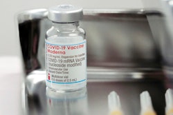 A Moderna COVID-19 vaccine vial is administered for flight attendants of Japan Airlines, Haneda Airport, Tokyo, June 14, 2021.