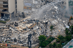 Rescue workers work in the rubble at the Champlain Towers South Condo in Surfside, Fla., in this Friday, June 25, 2021, file photo.