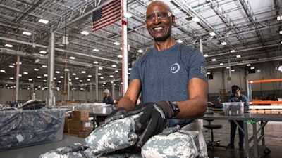 Dennis McDuffie checks first aid kits at LCI in Durham, NC. LCI is a nonprofit organization associated with National Industries for the Blind, the nation’s largest employment resource for people who are blind.