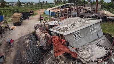 Machinery sits at the Etheuss vetiver oil factory after it was made inoperable by the 7.2 magnitude earthquake in Les Cayes, Haiti, Thursday, Aug. 19, 2021. Many of the factories that contributed to the multimillion-dollar industry responsible for more than half the world's vetiver oil used in fine perfumes, cosmetics, soaps and aromatherapy, are now inoperable.