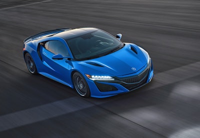This photo provided by Acura shows the 2021 Acura NSX, an exotic sports car with a hybrid powertrain and sharp handling.