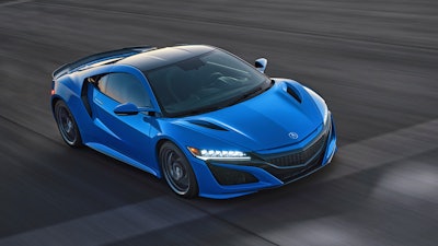 This photo provided by Acura shows the 2021 Acura NSX, an exotic sports car with a hybrid powertrain and sharp handling.