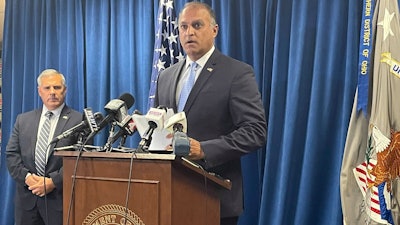 Acting U.S. Attorney Vipal J. Patel, center, accompanied by FBI Special Agent in Charge Chris Hoffman, speaks during a news conference in Cincinnati, Thursday, July 22, 2021. Federal authorities say Akron-based FirstEnergy Corp. would pay a $230 million penalty and fully cooperate as part of an agreement announced Thursday to settle federal charges against the company in a sweeping bribery scheme in Ohio.