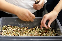 In this July 16, 2019, file photo, officers taking part in training load gun clips with ammunition at the Washington State Criminal Justice Training Commission in Burien, Wash. The COVID-19 pandemic coupled with record sales of firearms have created a shortage of ammunition in the United States that has impacting competition and recreational shooters, hunters, people seeking personal protection and law enforcement agencies.