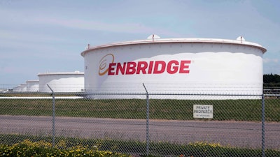 This June 29, 2018 file photo shows tanks at the Enbridge Energy terminal in Superior, Wis. The state of Minnesota has gone to federal court to block a lawsuit over Enbridge Energy's Line 3 oil pipeline project from proceeding in tribal court.