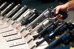 In this Jan. 19, 2016, file photo, handguns are displayed at the Smith & Wesson booth at the Shooting, Hunting and Outdoor Trade Show in Las Vegas. The Mexican government sued U.S. gun manufacturers and distributors, including some of the biggest names in guns like Smith & Wesson Brands, on Aug. 4, 2021 in U.S. federal court in Boston, arguing that their commercial practices have unleashed tremendous bloodshed in Mexico.