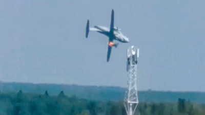 In this handout photo taken from video provided by Dmitry Ovchinnikov, the new light military transport burning plane Il-112V flies down near Kubinka airfield about 45 kilometers (28 miles) west of Moscow, Aug. 17, 2021.