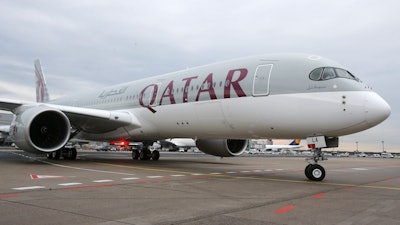 In this Jan. 15, 2015 file photo, a new Qatar Airways Airbus A350 approaches the gate at the airport in Frankfurt, Germany. Qatar Airways said Thursday, Aug. 5, 2021, that it has grounded 13 Airbus A350s over degradation of the plane's fuselage, further escalating a monthslong dispute with the European airplane maker.