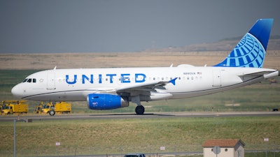 In this July 2, 2021 file photo, a United Airlines jetliner taxis down a runway for take off from Denver International Airport in Denver. United Airlines will require U.S.-based employees to be vaccinated against COVID-19 by late October, and maybe sooner. United announced the decision Friday, Aug. 6.