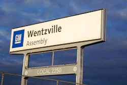 In this March 24, 2021 photo, a sign stands near an entrance to a General Motors assembly plant in Wentzville, Mo.