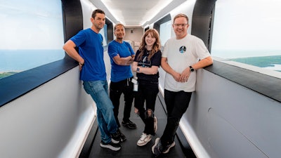 From left, Jared Isaacman, Sian Proctor, Hayley Arceneaux and Chris Sembroski stand in the crew access arm at Launch Complex 39A at Kennedy Space Center in Florida, July 28, 2021.