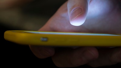 A man uses a cellphone in New Orleans, Aug. 11, 2019.