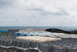 In this Feb. 27, 2021, file photo, tanks (in gray, beige and blue) store water that was treated but is still radioactive after it was used to cool down spent fuel at the Fukushima Daiichi nuclear power plant in Okuma town, Fukushima prefecture, northeastern Japan.