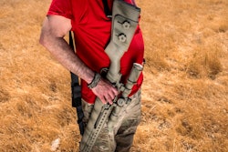Firearms instructor Michael Palombo holds a Springfield Armory M25 rifle during field testing to measure radio frequency identification signal range in Hickman, Calif., on Sunday, June 6, 2021. Palombo inserted an RFID tag into the rifle for the test.