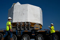 Workers secure a central solenoid magnet for the ITER project as it departs from Berre-l'Etang in southern France, Monday, Sept. 6, 2021. The first part of a massive magnet so strong its American manufacturer claims it can lift an aircraft carrier arrived Thursday, Sept. 9, 2021 at a high-security site in southern France, where scientists hope it will help them build a 'sun on earth.' Almost 60-feet tall and 14 feet in diameter when fully assembled, the magnet is a crucial component of the International Thermonuclear Experimental Reactor, or ITER, a 35-nation effort to develop an abundant and safe source of nuclear energy for future generations.