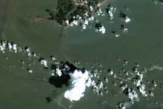 In a satellite image provided by Maxar Technologies, an oil slick is shown on Sept. 2, 2021 south of Port Fourchon, La. The U.S. Coast Guard said Saturday, Sept. 4, that cleanup crews are responding to a sizable oil spill in the Gulf of Mexico following Hurricane Ida.