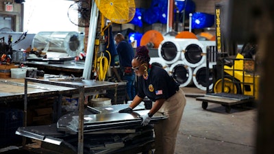 Sheet metal worker Carey Mercer assembles ductwork at Contractors Sheet Metal on Tuesday, Aug. 3, 2021, in New York. The construction industry is fighting to recruit more women into a sector that faces chronic labor shortages. As spending on infrastructure rises, construction firms will need to hire at least 430,000 new skilled laborers in 2021, according to an analysis of federal data by the Associated Builders and Contractors. Right now, only 4% of construction laborers in the U.S. are women, according to the Bureau of Labor Statistics