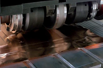 SonicLayer X̅ seam welding in action to produce copper foil onto copper busbar.
