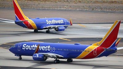 This July 17, 2019 file photo shows Southwest Airlines planes at Phoenix Sky Harbor International Airport in Phoenix. Southwest Airlines President Tom Nealon, who was once seen as a leading candidate for CEO but was passed over this year, has retired. Southwest said Monday, Sept. 13, 2021, that Nealon, 60, will still serve as an adviser focusing on environmental issues, including plans to reduce carbon emissions.