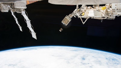Thousands of the satellites orbiting Earth are small – like this cubical satellite seen here being released from the International Space Station.