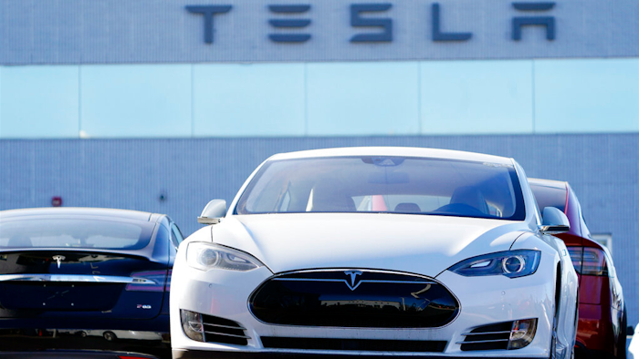 An unsold 2021 S70 sedan at a Tesla dealership.