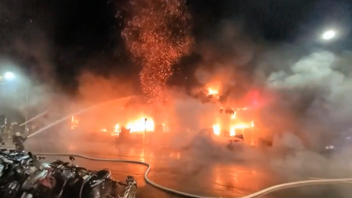 In this image taken from video by Taiwan's EBC, firefighters battle a blaze at a building in Kaohsiung, in southern Taiwan on Thursday, Oct. 14, 2021. A fire engulfed a 13-story building overnight in southern Taiwan, the island’s semi-official Central News Agency reported Thursday.