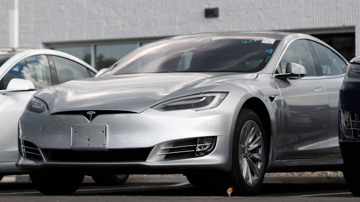 This July 8, 2018 photo shows Tesla 2018 Model 3 sedans sit on display outside a Tesla showroom in Littleton, Colo. Tesla wants to keep secret its response to the U.S. government’s request for information in an investigation of its Autopilot partially automated driving system.