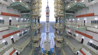 The Shenzhou-13 manned spaceship on a Long March-2F carrier rocket prepares to be transferred to the launching area of Jiuquan Satellite Launch Center, Oct. 7, 2021.