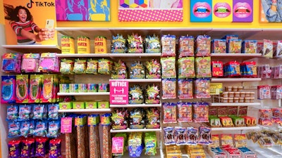 A column of candy, left, featured in TikTok videos is displayed at It'Sugar candy store, Wednesday, Oct. 6, 2021, on the Upper East Side of New York.