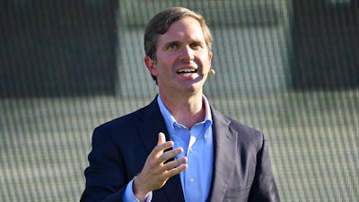 Kentucky Gov. Andy Beshear speaks during the official announcement of Ford Motor Company along with SK Innovations in building two electric battery factories in Glendale, Ky., at the Kentucky State Capitol in Frankfort, Ky., Tuesday, Sept. 28, 2021.