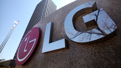 This April 5, 2021 file photo shows the logo of LG Electronics Inc. outside of the company's office building in Seoul, South Korea. LG Electronics has reached a deal with General Motors to pay as much as $2 billion to reimburse the automaker for the cost of recalling Chevrolet Bolt electric vehicles due to battery fires.