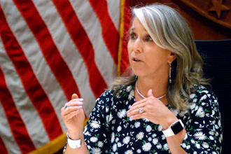 In this July 29, 2021, file photo New Mexico Gov. Michelle Lujan Grisham speaks at a news conference in Santa Fe, N.M. Grisham is returning to the podium next week at an annual gathering of oil executives. She's also contemplating attendance at the U.N. Climate Conference in Scotland in November, internal emails show.